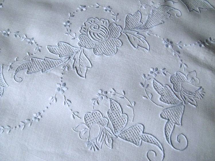 close up 2 vintage antique white linen table topper with handmade Appenzell lace and blue embroidery
