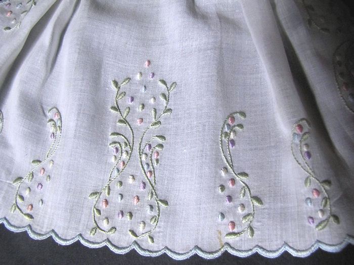 close up vintage antique victorian jabot with pastel embroidery