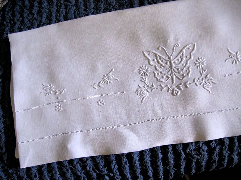 close up vintage single pillowcase handmade whitework butterfly