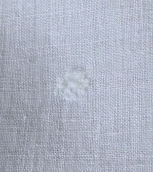 mend on vintage white linen table topper handmade lace