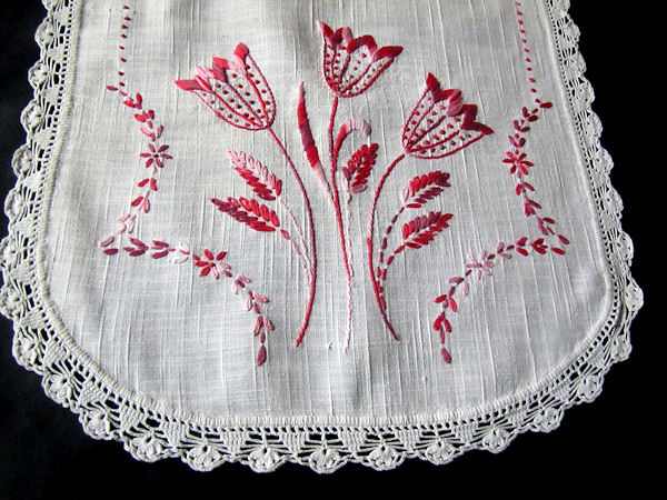 close up vintage antique linen table runner dresser scarf handmade lace and red embroidered tulips