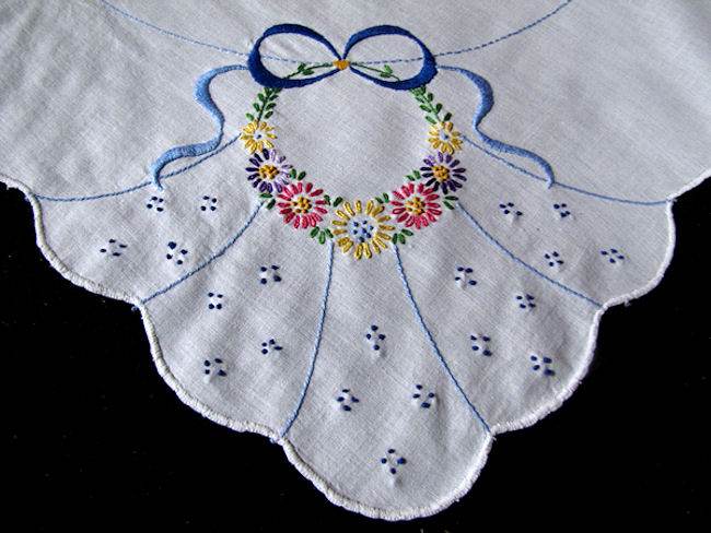close up vintage hand embroidered table topper