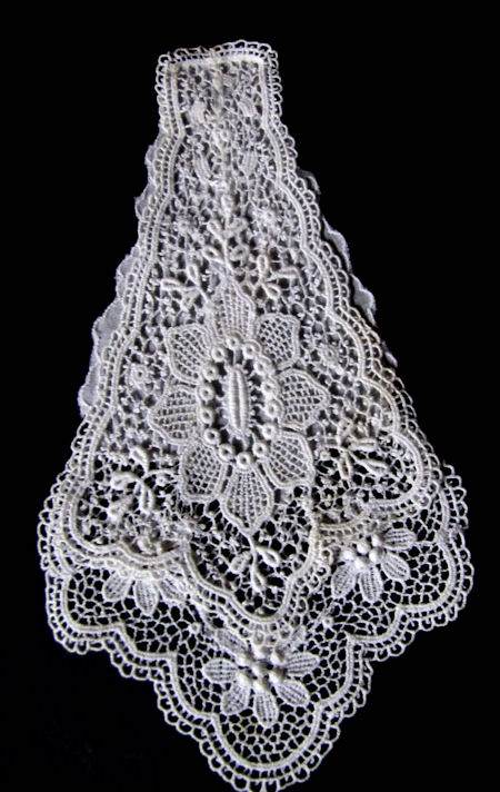 close up vintage antique lace jabot with whitework