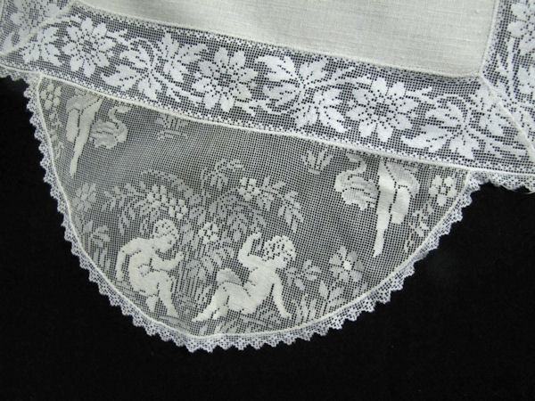 close up vintage antique table runner dresser scarf figural lace cherubs