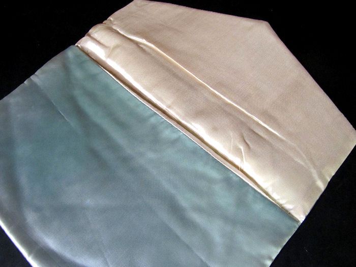 close up vintage antique lingerie folder bag
