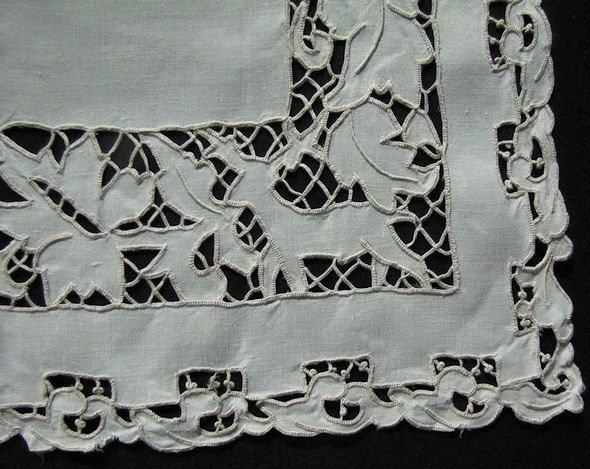 close-up deer on vintage figural lace placemats