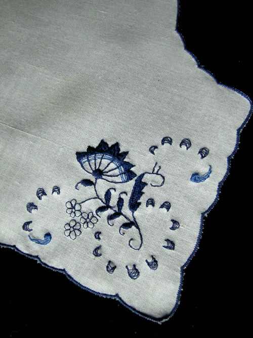 close up vintage Delft embroidered roll cover