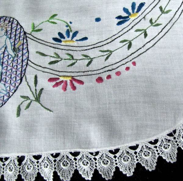 close up 3 vintage antique white linen table topper with figural embroidery