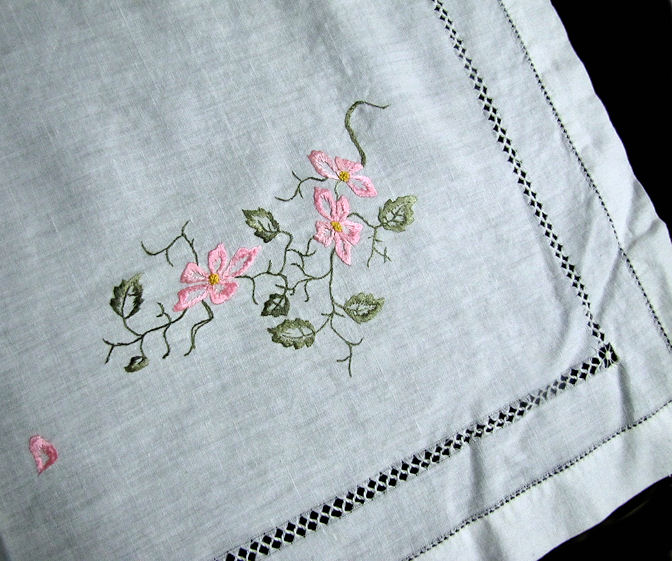 close up vintage antique white linen table topper with society silk embroidery