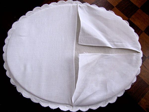 close up vintage white linen hot plate pad hand embroidery