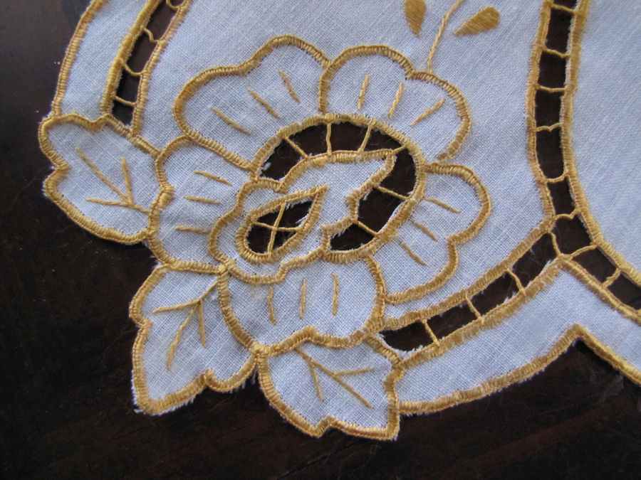 close up vintage antique handmade table runner lace and embroidery