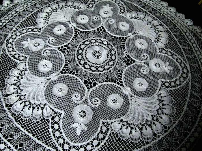 close up vintage antique handmade bobbin lace tablecloth