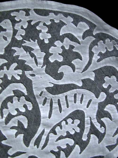 close-up vintage antique figural lace doily