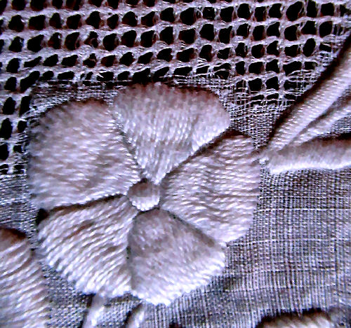 extreme close up of handmade doilies lace and whitework embroidery