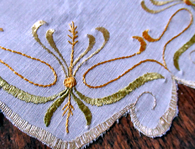 close up vintage  antique handmade art nouveau design society silk embroidered doily