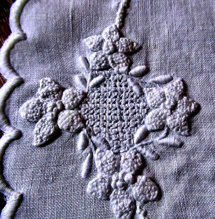 close up vintage  antique handmade round white linen embroidered doily
