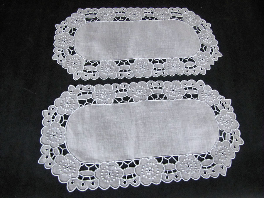 close up vintage antique doily pair with cutwork lace