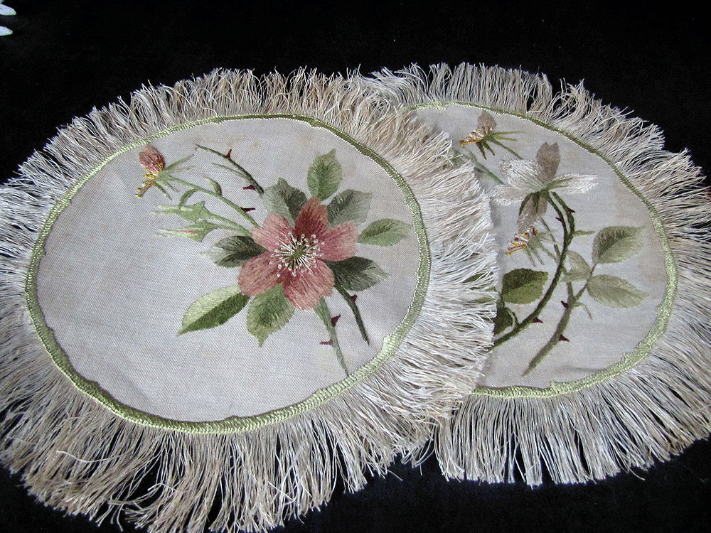 close up vintage antique pair society silk embroidered doilies