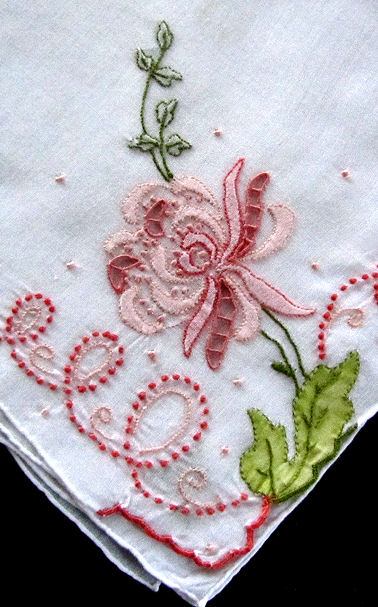 close up vintage antique handmade embroidered hanky with lace and applique