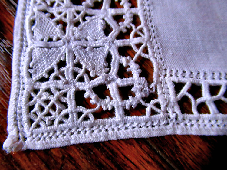 Close up vintage  antique handmade placemats white linen reticella needle lace