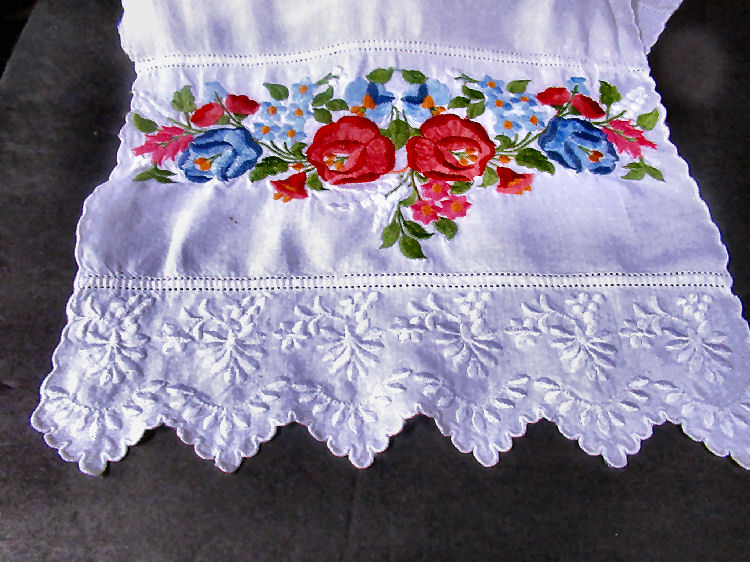 close up vintage  antique handmade table runner red roses and whitework