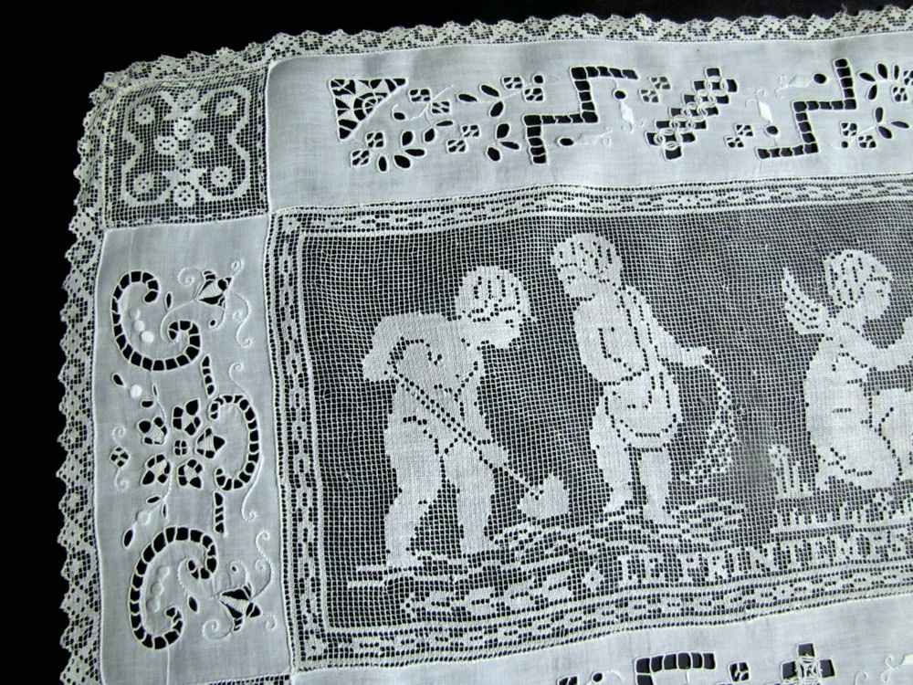close up vintage antique table runner handmade figural lace and whitework