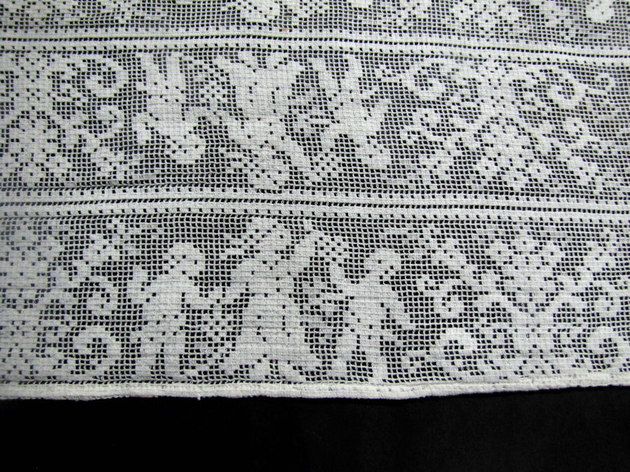 close up vintage antique table runner figural lace