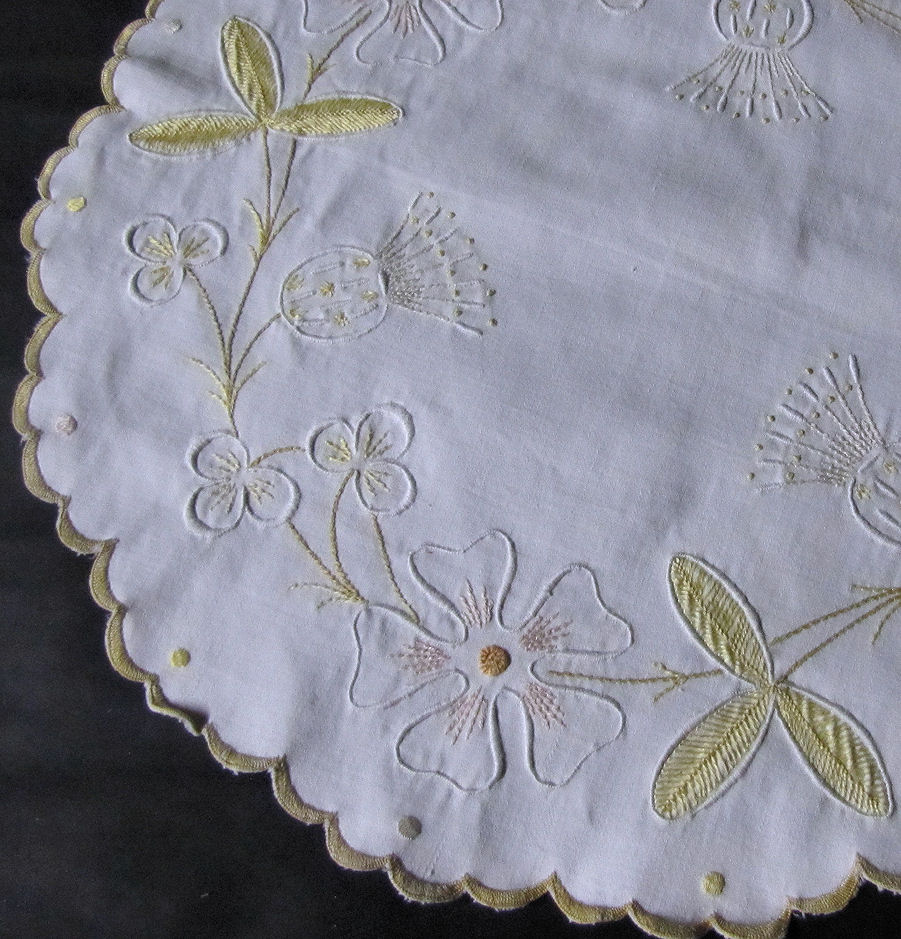 close up vintage antique hand embroidered table topper