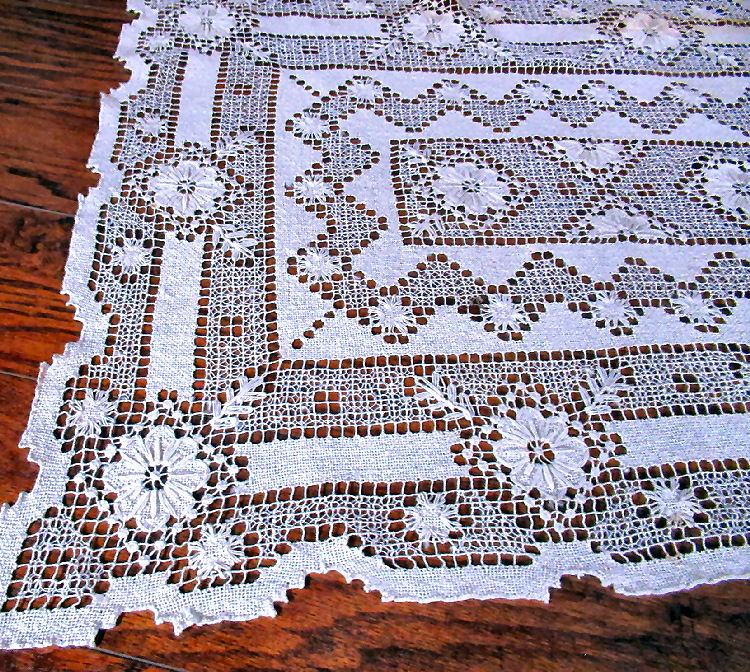 close up vintage geometric handmade lace antique table topper