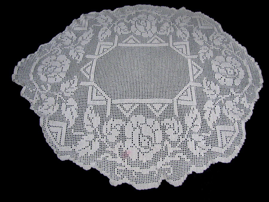 close up vintage antique table topper handmade lace