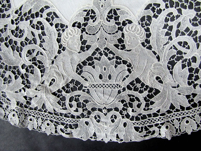 close up vintage antique figural lace table topper