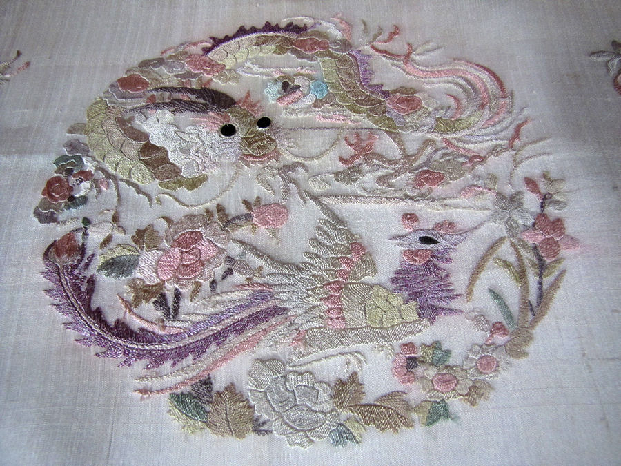 close up vintage antique silk oriental hand embroidered table topper stork and koi fish