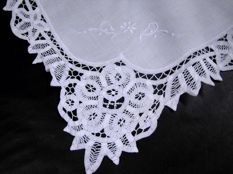 close up vintage antique table topper handmade lace whitework embroidery