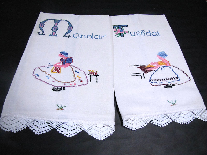 close up vintage antique towels hand embroidered days of the week
